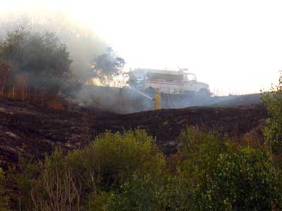 Rural firefighters put out blaze by Susan Fluegel at Grey Duck Garlic